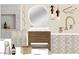 This guest bathroom features a stylish vanity, shower tile, a modern faucet and contemporary fixtures at 4729 E Arcadia Ln, Phoenix, AZ 85018