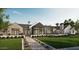Stunning modern home with a mix of stone and siding, lush landscaping, and a welcoming entrance at 4729 E Arcadia Ln, Phoenix, AZ 85018