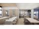 Open concept kitchen with double island, light wood cabinetry, marble countertops, and a seamless flow to outdoor living at 4729 E Arcadia Ln, Phoenix, AZ 85018
