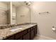 Spacious bathroom with dual sinks, granite countertop, and a large mirror at 4834 E Robin Ln, Phoenix, AZ 85054
