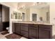 Spacious bathroom with double sinks, granite countertops, and dark wood cabinets at 4834 E Robin Ln, Phoenix, AZ 85054