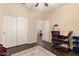 Bedroom featuring a work desk and a large closet with wood-style floors at 4834 E Robin Ln, Phoenix, AZ 85054