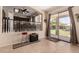 Open dining area with backyard patio access through sliding glass door and a red stool at 4834 E Robin Ln, Phoenix, AZ 85054