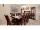Dining room featuring a large wooden table with seating for eight at 4834 E Robin Ln, Phoenix, AZ 85054