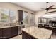 Spacious kitchen featuring an island, stainless steel appliances, and plenty of natural light at 4834 E Robin Ln, Phoenix, AZ 85054