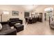 Open concept living and dining area featuring tile floors and high ceilings at 4834 E Robin Ln, Phoenix, AZ 85054