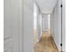 Hallway with modern flooring leads to various rooms at 5371 S Country Club Way, Tempe, AZ 85283