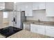 A bright kitchen with stainless steel appliances, granite countertops, and ample cabinet space at 5371 S Country Club Way, Tempe, AZ 85283