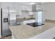Contemporary kitchen featuring granite countertops and stainless steel appliances in a bright space at 5371 S Country Club Way, Tempe, AZ 85283