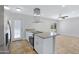 Open kitchen featuring stainless steel appliances, granite countertops, and modern vent hood at 5371 S Country Club Way, Tempe, AZ 85283