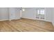 Light-filled room featuring modern flooring and a door leading to another room at 5371 S Country Club Way, Tempe, AZ 85283