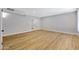 Bright room featuring modern flooring and a door leading to another room at 5371 S Country Club Way, Tempe, AZ 85283