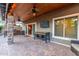 Spacious backyard patio with a complete outdoor kitchen, ceiling fans, and comfortable seating, ideal for entertaining at 5443 W Hobby Horse Dr, Phoenix, AZ 85083