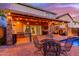 Outdoor living at its finest, with a covered patio and seating, barbecue, and pool at 5443 W Hobby Horse Dr, Phoenix, AZ 85083