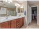 Bathroom features a double vanity and separate access to shower and walk-in closet at 5443 W Hobby Horse Dr, Phoenix, AZ 85083