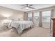 Comfortable bedroom with large windows, ceiling fan, and neutral decor at 5443 W Hobby Horse Dr, Phoenix, AZ 85083