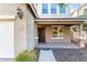 Charming home exterior featuring a covered entryway and easy-care desert landscaping at 5443 W Hobby Horse Dr, Phoenix, AZ 85083