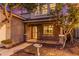 Inviting front facade with a cozy porch, desert landscaping, and a charming birdbath feature at 5443 W Hobby Horse Dr, Phoenix, AZ 85083