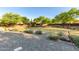 Community green space with shrubs and trees, offering a natural setting at 5443 W Hobby Horse Dr, Phoenix, AZ 85083