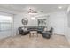 Spacious living room with ceramic tile floors, decorative ceiling fan and chandelier at 5443 W Hobby Horse Dr, Phoenix, AZ 85083