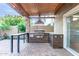 Functional outdoor kitchen with a built-in grill and prep space, enhancing the outdoor living experience at 5443 W Hobby Horse Dr, Phoenix, AZ 85083