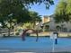 A neighborhood playground with a colorful play structure, surrounded by trees at 5443 W Hobby Horse Dr, Phoenix, AZ 85083
