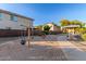 Community playground featuring swings and play structure in a sand-covered area at 5443 W Hobby Horse Dr, Phoenix, AZ 85083