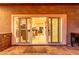 Inviting view through sliding doors to the home's interior, offering a seamless indoor-outdoor living experience at 5443 W Hobby Horse Dr, Phoenix, AZ 85083