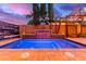 Backyard pool with a tiled water feature and lush landscaping creating a private oasis at 5443 W Hobby Horse Dr, Phoenix, AZ 85083