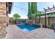 Inviting swimming pool area with manicured landscaping and privacy features, creating a serene backyard oasis at 5443 W Hobby Horse Dr, Phoenix, AZ 85083