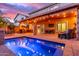 Inviting swimming pool with a patio and covered lounge area, perfect for entertaining at 5443 W Hobby Horse Dr, Phoenix, AZ 85083