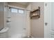 Bright bathroom featuring a stand up shower with white tile and a window for plenty of light at 6172 W Kerry Ln, Glendale, AZ 85308