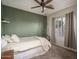 Comfortable bedroom featuring a full bed, neutral color scheme, and a cozy hanging chair at 6172 W Kerry Ln, Glendale, AZ 85308