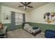 Bright bedroom with a twin bed, stylish decor, and a window with natural light at 6172 W Kerry Ln, Glendale, AZ 85308