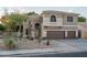 Inviting home with a three-car garage and desert landscaping for low maintenance appeal at 6172 W Kerry Ln, Glendale, AZ 85308