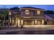 Inviting two-story home with a three car garage and desert landscaping at 6172 W Kerry Ln, Glendale, AZ 85308