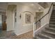 Foyer area featuring a staircase and tiled floors that add a touch of elegance at 6172 W Kerry Ln, Glendale, AZ 85308