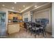 Bright eat-in kitchen area with wood cabinets and seating for four at 6172 W Kerry Ln, Glendale, AZ 85308