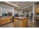 Well-lit kitchen featuring an island and backyard views at 6172 W Kerry Ln, Glendale, AZ 85308