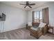 Inviting living room with a comfortable sectional couch, soft carpet, and a side table with lamp at 6172 W Kerry Ln, Glendale, AZ 85308