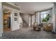 Spacious living room with carpet, natural lighting, and an open floorplan at 6172 W Kerry Ln, Glendale, AZ 85308