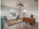 Home office with a unique desk and large windows at 6172 W Kerry Ln, Glendale, AZ 85308