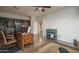 Spacious office featuring a wooden desk, ample storage, and safe for securing valuables, with an opening to a bedroom at 6172 W Kerry Ln, Glendale, AZ 85308