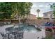 A sparkling pool is surrounded by lush landscaping and comfortable seating, ideal for outdoor living and entertaining at 6172 W Kerry Ln, Glendale, AZ 85308