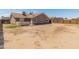Expansive backyard with secure wood fence, perfect for outdoor activities and entertaining at 6936 W Monterey Way, Phoenix, AZ 85033