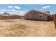 Spacious backyard featuring plenty of open space and a wooden fence at 6936 W Monterey Way, Phoenix, AZ 85033