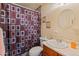 Bathroom featuring a marble sink, toilet, and full shower at 6936 W Monterey Way, Phoenix, AZ 85033