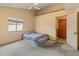 Bedroom featuring vaulted ceilings, a ceiling fan, and carpet flooring at 6936 W Monterey Way, Phoenix, AZ 85033
