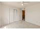 Bedroom with a sliding door closet and doorway to another room at 6936 W Monterey Way, Phoenix, AZ 85033