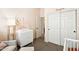 Neutral Bedroom with changing table, large closet, and comfortable reading chair at 6937 E Sierra Morena Cir, Mesa, AZ 85207